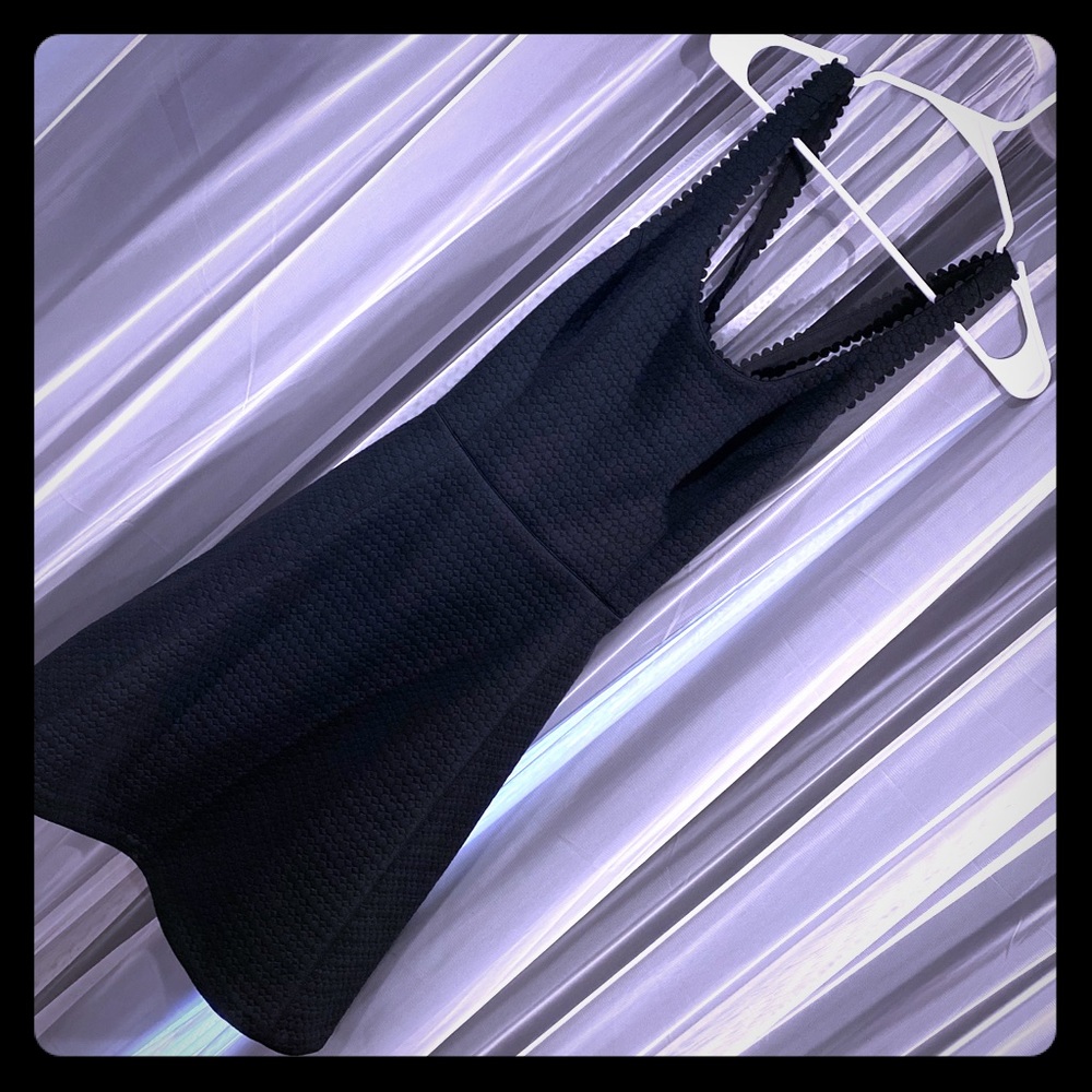Black Club Monaco dress with back cut out.Like new